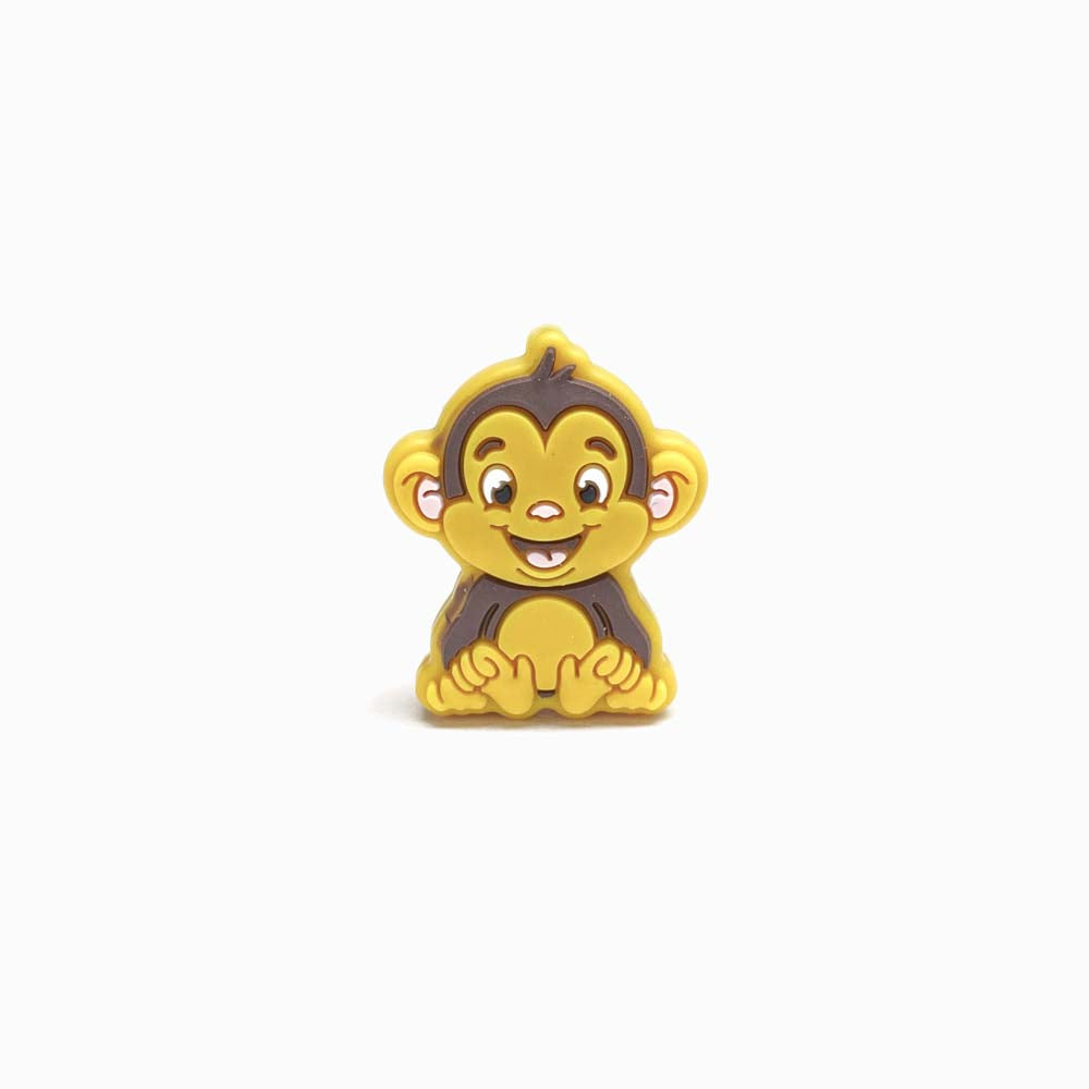 Contas de silicone para prendedor de chucha design macaco 30x24mm amarelo torrado